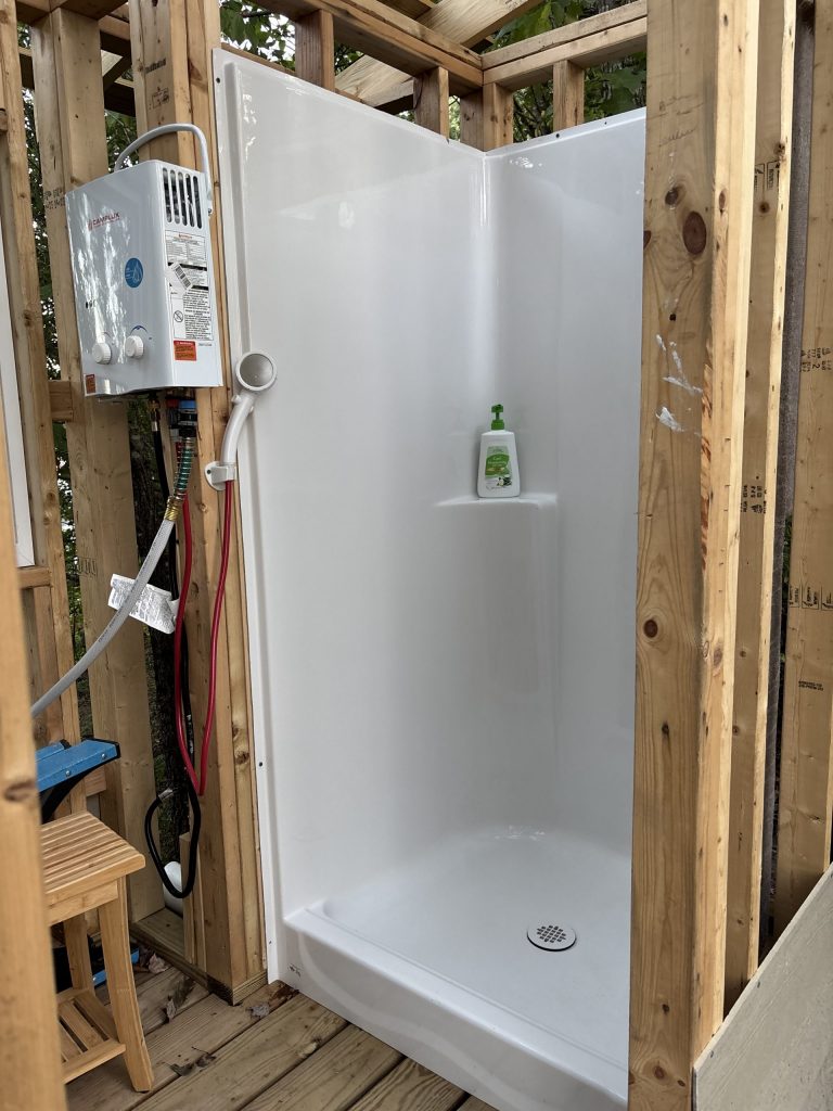 hilltop sunrise urban camping wall-side tent new river gorge bridge Fayette county Fayetteville oak hill hilltop WV West Virginia tent bath house with hot shower close up