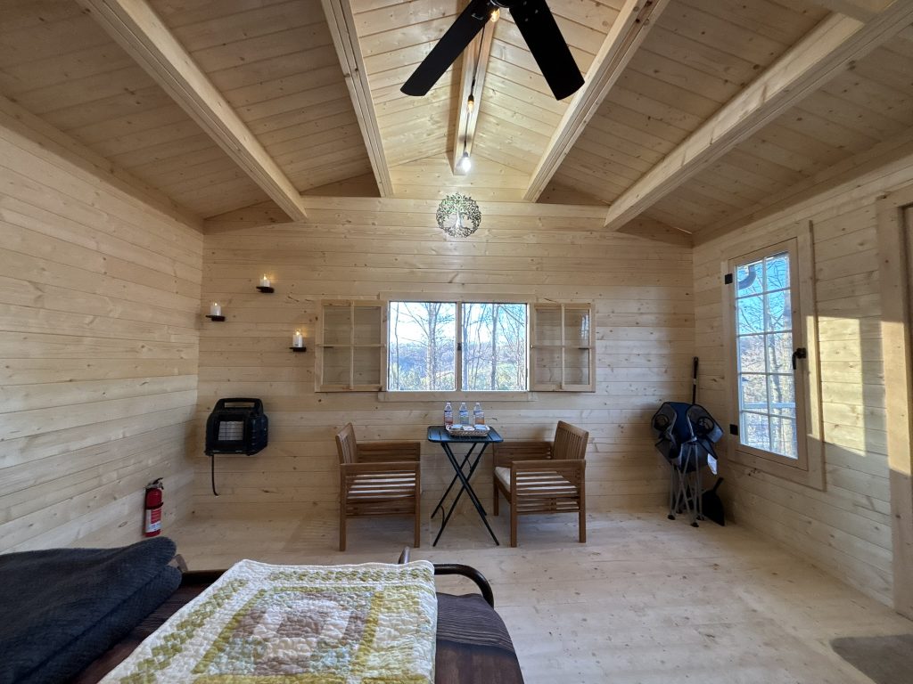 hilltop sunrise urban bunkie-style cabin hot shower queen bed new river gorge bridge Fayette county Fayetteville oak hill hilltop WV West Virginia full resolution dining table