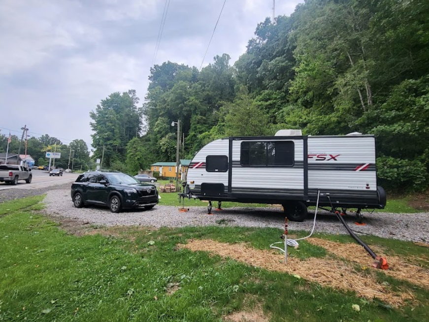hilltop sunrise RV camper site with full hookups electric water sewer trash parking pet station porta potty 110 volt AC outletnew river gorge national park and preserve Summit Bechtel Reserve Fayette county Fayetteville oak hill hilltop WV West Virginia