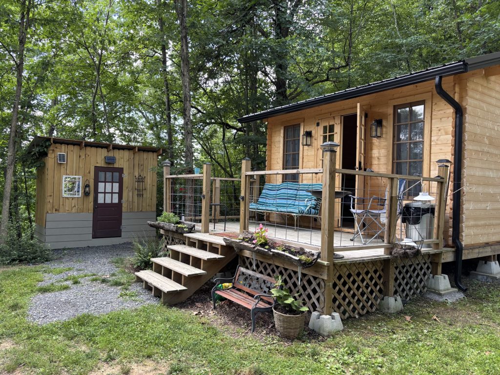 hilltop sunrise urban bunkie-style cabin private hot outdoor shower queen bed flush toilet new river gorge bridge Fayette county Fayetteville oak hill hilltop WV West Virginia side view full resolution includes shower house with open door